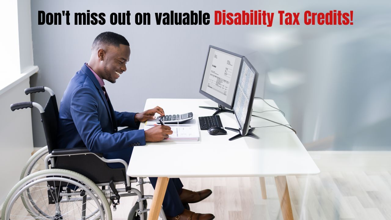 Person smiling while looking at paperwork and holding a pen, symbolizing the process of applying for the Disability Tax Credit.
